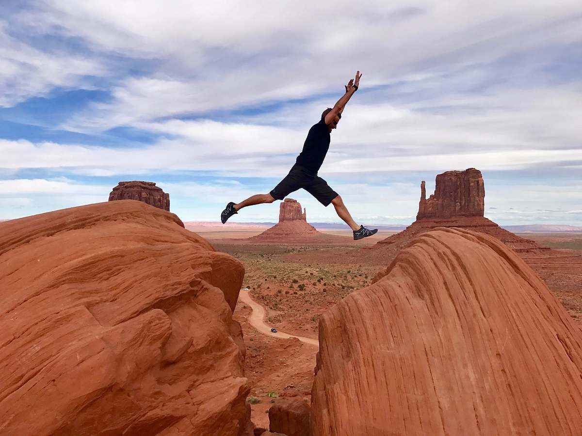 united states man jumping on canyon man